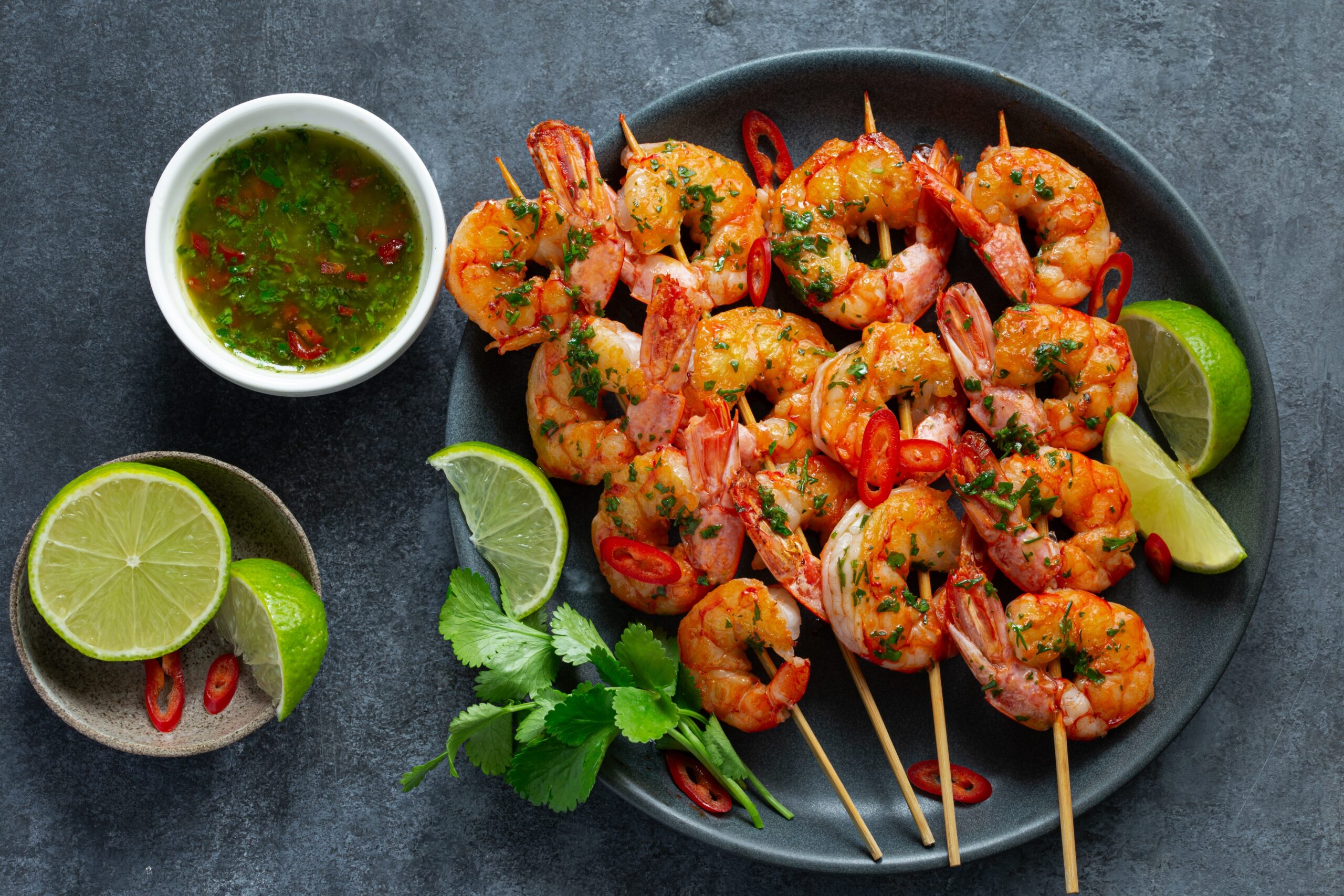 Grilled,Shrimps,Skewers,With,Green,Chimichurri,Sauce,,Top,View,,Dark
